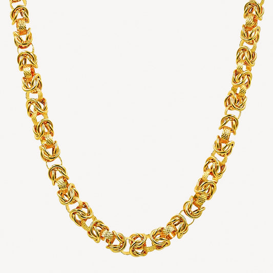 A gold-colored hollow dragonbone chain necklace.