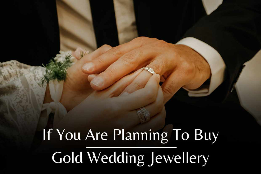 Two hands holding a gold wedding ring | Wedding ring exchanging.